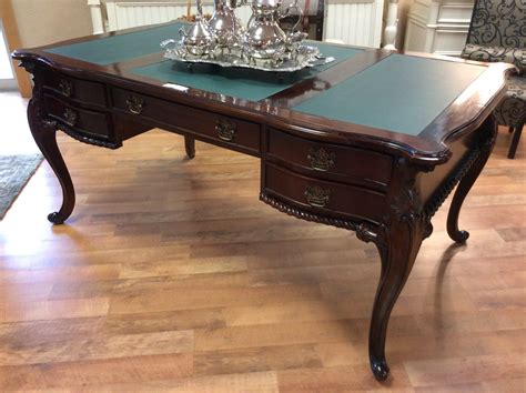 This Elegant Writing Desk Has A Rich Dark Mahogany Finish And Offers
