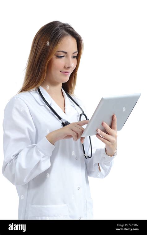 Beautiful Female Doctor Browsing A Tablet Pc While She Is Working Isolated On A White Background