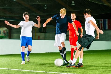 Premium Photo Team Playing Football Or Soccer Indoor