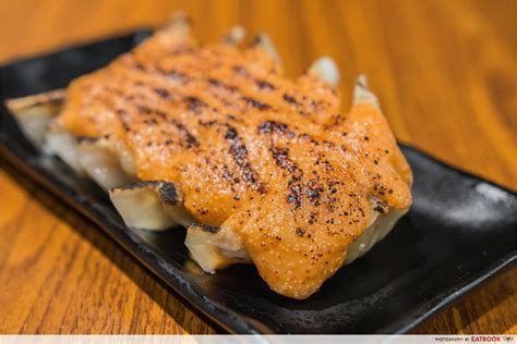 Place a plate on top of gyoza. Gyoza-ya Review: Mentaiko, Cheese And Truffle Gyoza At ...