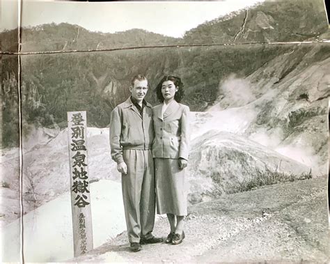 my wife s grandma and grandpa in japan circa 1940s any ideas what the sign says r