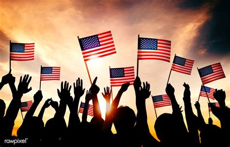Group Of People Waving American Flags In Back Lit Free Image By