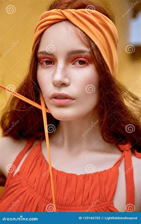 Fashionable Woman With Red Hair And Makeup Posing Stock Photo Image