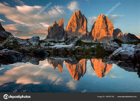 Tre Cime Di Lavaredo With Reflection In Lake At Sundown Dolomit