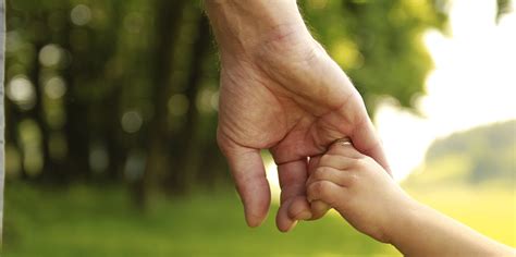 Parent Holds The Hand Of A Small Child Michael A Verdicchio
