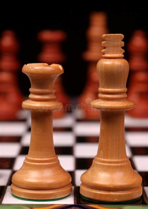 I think chess has had only a usually when i see the king and queen switched around in the initial setup, they're in amateur games King And Queen On Chess Board Royalty Free Stock Image ...