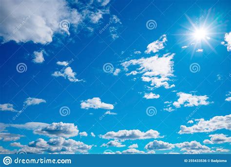 Beautiful Blue Sky With Air Clouds And Sun Rays Stock Photo Image Of