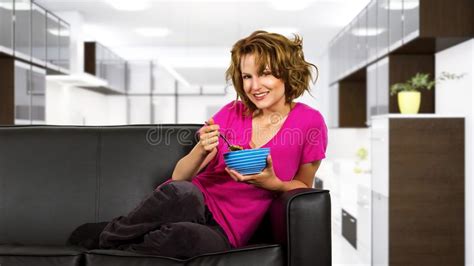Woman Eating Breakfast On A Couch Stock Image Image Of Eating Diet