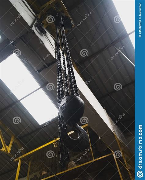 Overhead Crane Hook Connected With Chain In The Industry Stock Photo