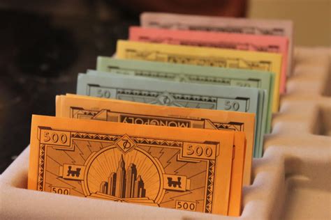 Monopoly notes come in the following colors: Arranged Money | Another picture of some monopoly money. | Anil Mohabir | Flickr