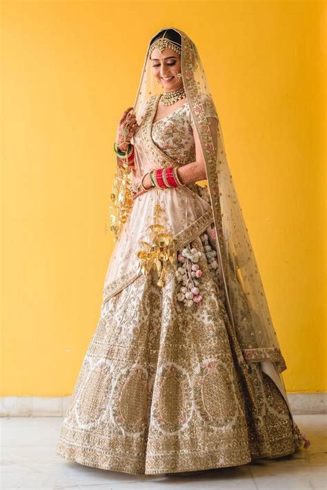 Photo Of White And Gold Bridal Lehenga With Double Dupatta Indian