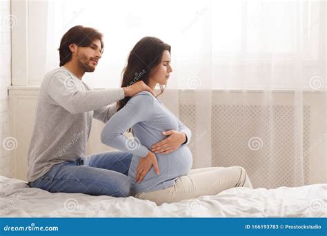 Caring Husband Massaging Shoulders Of His Pregnant Wife Stock Image Image Of Lifestyle