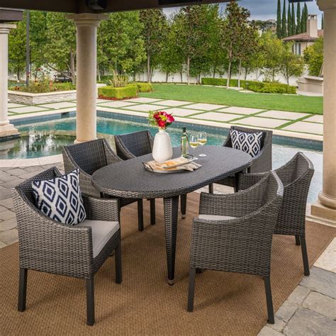 Benjamin Outdoor 7 Piece Oval Wicker Dining Set With Cushions By