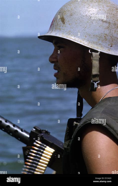 Vietnam War A Navy Gunner Mans His 50 Caliber Machine Gun On Utility