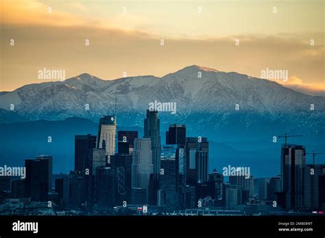 Los Angeles Skyline Contrasts Snow Capped Mountains Stock Photo Alamy