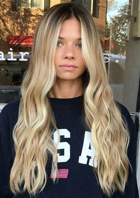 Dark roots create a color melt effect. Best beach blonde hairstyles and hair colors are always in ...