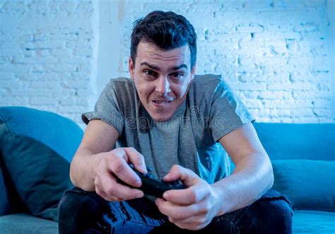 Close Up Portrait Of Young Man Playing Video Game At Night Addicted To