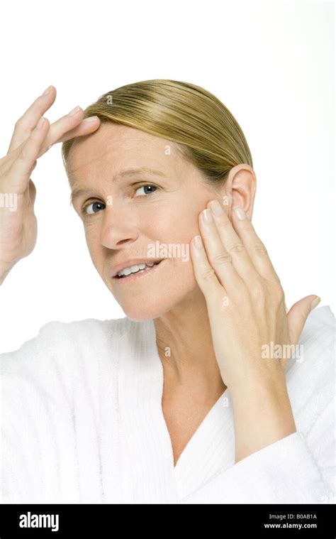 Woman Touching Forehead And Cheek Close Up Stock Photo Alamy