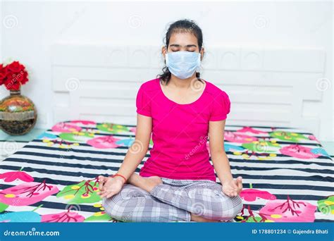 Young Girl Doing Yoga Indoor During Quarantine Doing Meditation During