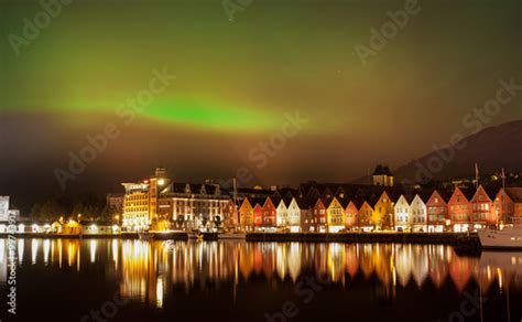 Green Northern Lights Above The Bryggen Hanseatic Wharf Houses Bergen