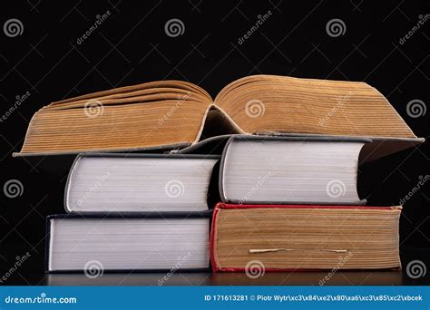 An Open Thick Book On A Stack Of Other Books Extensive Books