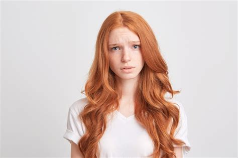 Free Photo Portrait Of Upset Depressed Young Woman With Red Wavy Long