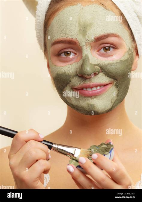 Skin Care Woman Applying With Brush Clay Mud Mask To Her Face Girl Taking Care Of Oily