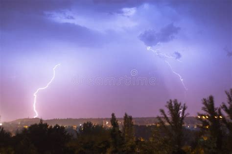 Night Lightning Storm Over City In Blue Dramatic Lighting Stock Photo