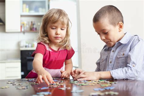 As a kid, i used to play with matchstick puzzles. Children, playing puzzles stock photo. Image of ...