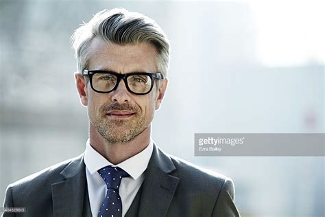 Stock Foto Portrait Of A Businessman Wearing Glasses Grey Hair