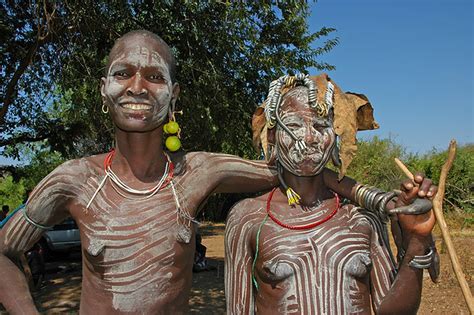 The Mursi Tribe Women From The Mursi Tribe Pose In Front O Flickr