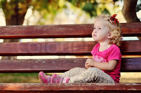 Toddler On Bench Stock Image Colourbox