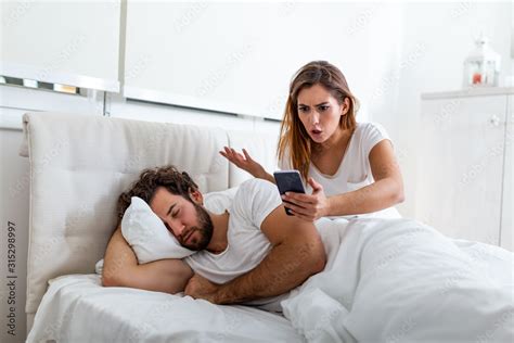 Jealous Wife Spying The Phone Of Her Partner While He Is Sleeping In A