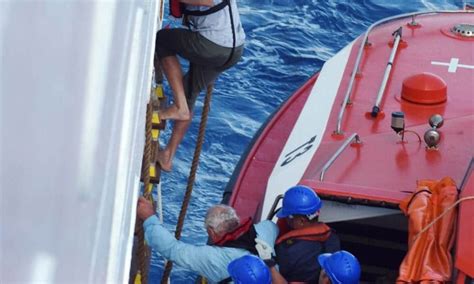 Cruise Ship Rescues Passengers From Sinking Yacht Photos