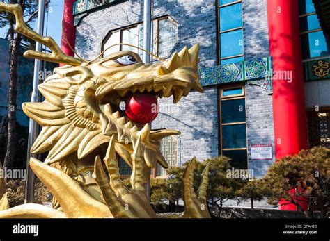 Golden Dragon Statue Outside Of A Building In The Chinatown District Of