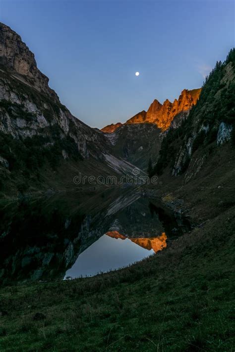 The Moon And The Alpstein Mountain Range Reflecting On The Faelensee