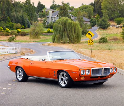 1969 Pontiac Firebird Convertible Orange 34 Front View On Road By