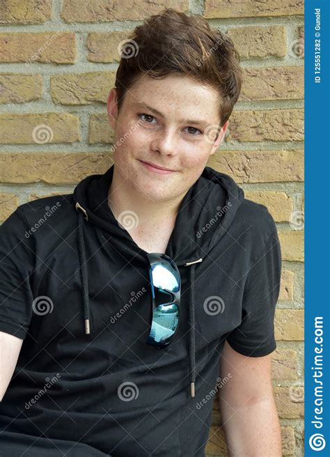 Portrait Of A Smiling Teenage Boy Stock Photo - Image of behavior, black: 125551282