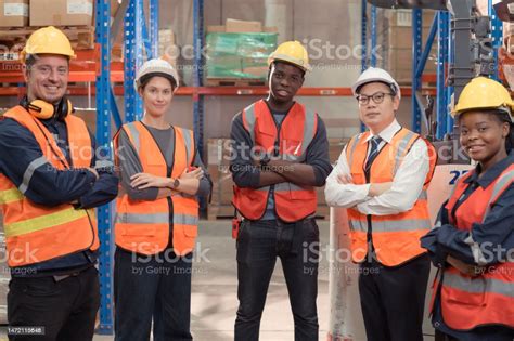 Portrait Of Group Employees In A Warehouse Consisting Of Warehouse