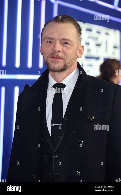 Simon Pegg Poses For Photographers Upon Arrival At The Premiere Of The