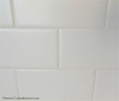 I love pictures where the tile and grout flow as one. White Subway Tile Backsplash - Newton Custom Interiors