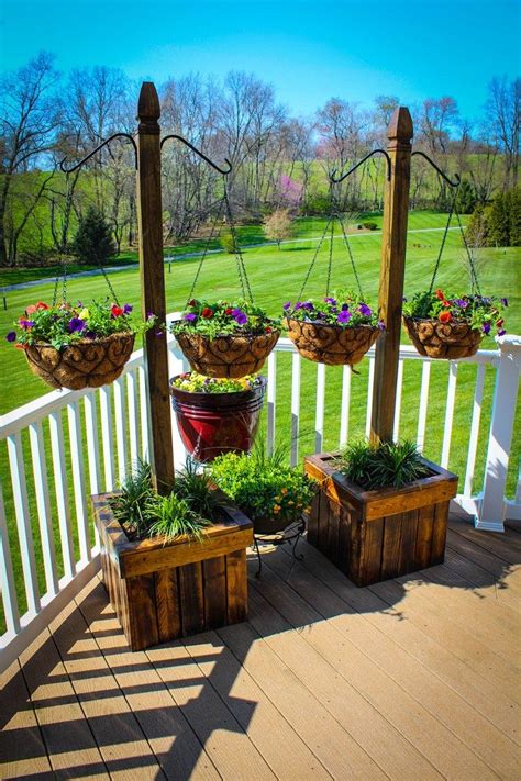Beautiful hanging container garden ideas. Decorate your patio with pretty flowers in a hanging ...