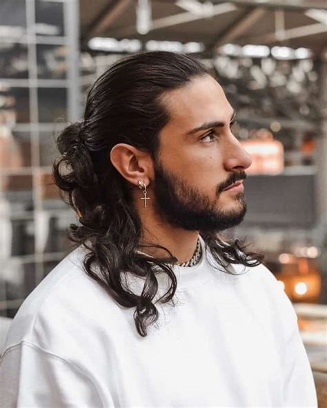 With a high, almost skin fade, all attention is drawn to the top of the head, where all you have to do is rub a small amount of hair wax throughout the lengths for definition and texture. 6 Best Long Hairstyles for Men With Thick Hair