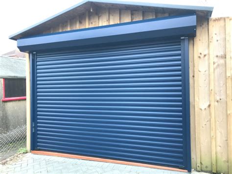 Custom wood, and steel garage doors painted with wooden look. External Automated Roller Garage Door - Dorset Garage Doors