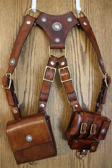 If you want to make a cowboy costume for halloween, a gun holster with a revolver tucked in the pouch is essential. How To Make A Leather Shoulder Holster