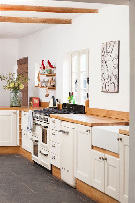 Wood cabinets are heavy duty, durable and can fit into any style. Different Ways to Style a White Wood Kitchen | Solid Wood Kitchen Cabinets Blog