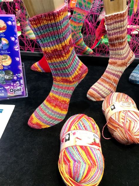 Some Socks And Balls Of Yarn Are On Display