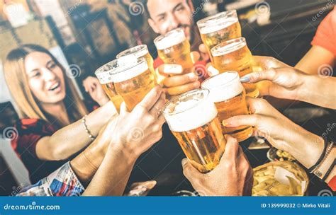 People Drinking Beer In Bavarian Pub Stock Photo
