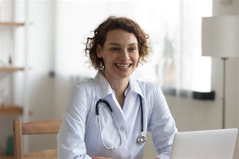 Smiling Female Doctor Talk Consult Patient In Hospital Stock Photo
