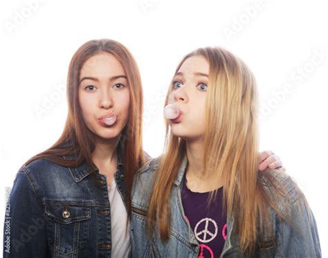 Photo Stock Teenage Girs Blows Big Bubble From Bubble Gum Adobe Stock
